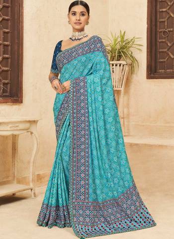 Attrective Looking These Saree in Fine Colored pair With Blouse.These Saree is Fabricated On Chinon Pair With Dhupoin Silk Blouse.Its Beautified With Bandhni Printed,Mirror, Sequance Embroidery Work.