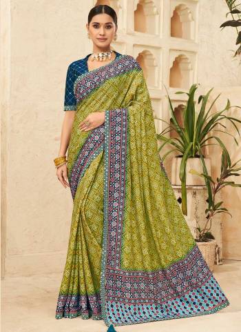 Attrective Looking These Saree in Fine Colored pair With Blouse.These Saree is Fabricated On Chinon Pair With Dhupoin Silk Blouse.Its Beautified With Bandhni Printed,Mirror, Sequance Embroidery Work.