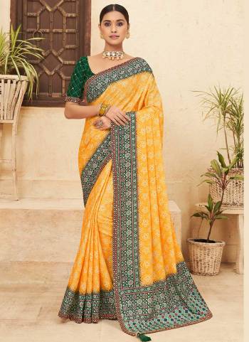 Attrective Looking These Saree in Fine Colored pair With Blouse.These Saree is Fabricated On Chinon Pair With Dhupoin Silk Blouse.Its Beautified With Bandhni Printed,Mirror, Sequance Embroidery Work.