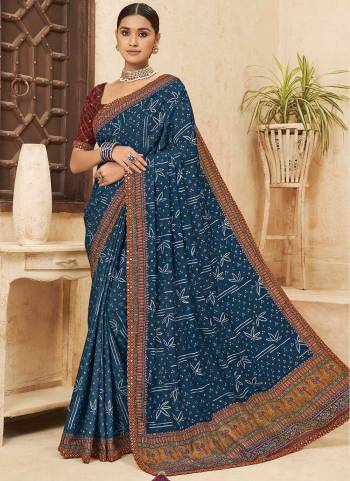 Attrective Looking These Saree in Fine Colored pair With Blouse.These Saree is Fabricated On Chinon Pair With Dhupoin Silk Blouse.Its Beautified With Bandhni Printed,Mirror, Sequance Embroidery Work.