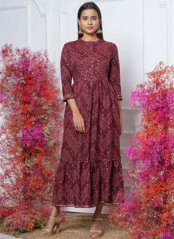 This Trendy yet Readymade Kurti Are Attractive Poduct Look Stylish Effortlessly. This Fine Color Rayon Fabriced with Bandhani Printed With Embroidery Work.