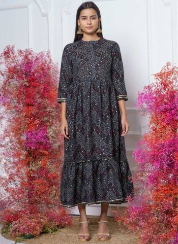 This Trendy yet Readymade Kurti Are Attractive Poduct Look Stylish Effortlessly. This Fine Color Rayon Fabriced with Bandhani Printed With Embroidery Work.