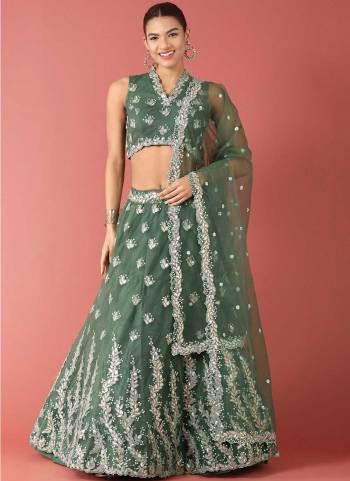 Garb This Partywear Fine Color Heavy Designer Choli Fabric Are Net And Lahenga Net And Dupatta Net In Fabricated Beautified With Attrective Embroidery Work. Buy Now.