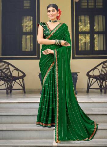 Grab These Party Wear Saree in Fine Colored.These Saree Are Chiffon And Blouse is Fabricated On Jacquard Silk.Its Beautified With Swarovski ,Embroidery Work.