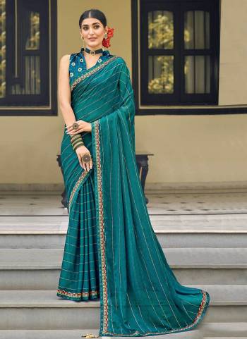 Grab These Party Wear Saree in Fine Colored.These Saree Are Chiffon And Blouse is Fabricated On Jacquard Silk.Its Beautified With Swarovski ,Embroidery Work.