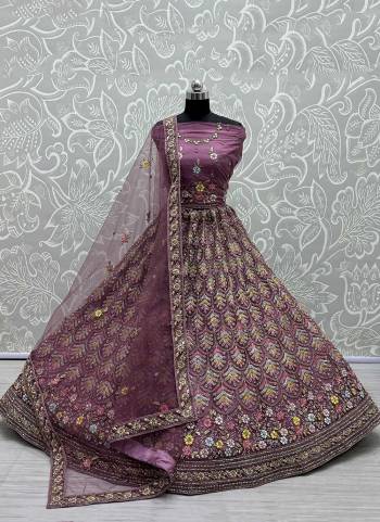 For A Designer Look,Grab These Lehenga Choli in Fine Colored.These Lehenga Choli Are Bridal Net And Dupatta Are Fabricated On Soft Net Pair.Its Beautified With Fancy Designer Multy Thread,Jari Embroidery,Diamond Work.