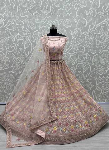 For A Designer Look,Grab These Lehenga Choli in Fine Colored.These Lehenga Choli Are Bridal Net And Dupatta Are Fabricated On Soft Net Pair.Its Beautified With Fancy Designer Multy Thread,Jari Embroidery,Diamond Work.