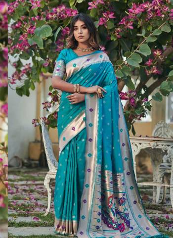 Garb These Festive Wear Saree in Fine Colored.These Saree And Blouse is Fabricated On Banarasi Soft Silk.Its Beautified With Weavon Paithani Jari Designer.