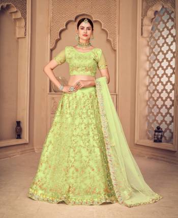 For A Designer Look,Grab These Lehenga Choli in Fine Colored.These Lehenga Choli Are Net And Dupatta Are Fabricated On Net Pair.Its Beautified With Fancy Designer Multy Thread Embroidery,Diamond Work.