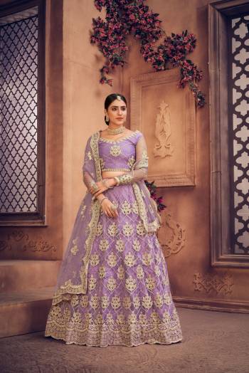 For A Designer Look,Grab These Lehenga Choli in Fine Colored.These Lehenga Choli Are Net And Dupatta Are Fabricated On Net Pair.Its Beautified With Fancy Designer Multy Thread Embroidery,Diamond Work.