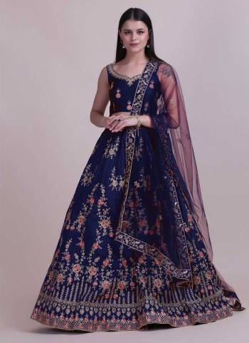 For A Designer Look,Grab These Lehenga Choli in Fine Colored.These Lehenga Choli Are Taffeta Silk And Dupatta Are Fabricated On Net Pair.Its Beautified With Fancy Designer Thread Embroidery,Stone Work.