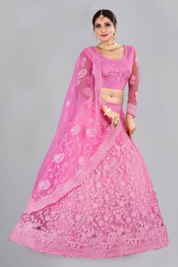 For A Designer Look,Grab These Lehenga Choli in Fine Colored.These Lehenga Choli And Dupatta Are Fabricated On Net Pair.Its Beautified With Fancy Designer Thread Embroidery,Stone Work.