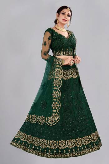 For A Designer Look,Grab These Lehenga Choli in Fine Colored.These Lehenga Choli And Dupatta Are Fabricated On Net Pair.Its Beautified With Fancy Designer Thread Embroidery,Stone Work.