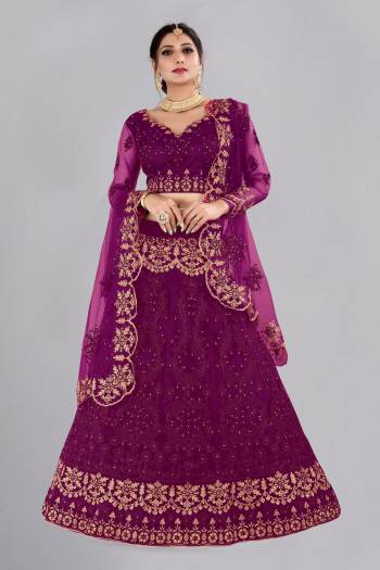 For A Designer Look,Grab These Lehenga Choli in Fine Colored.These Lehenga Choli And Dupatta Are Fabricated On Net Pair.Its Beautified With Fancy Designer Thread Embroidery,Stone Work.