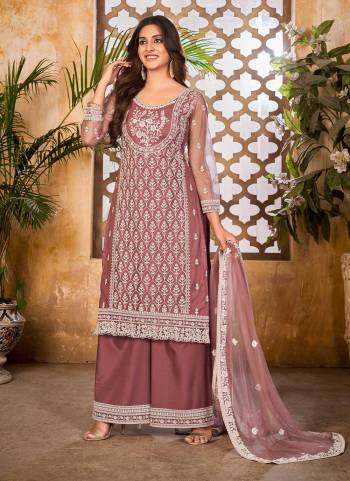 Grab These Plazzo Suit in Fine Dusty Colored Pair With Bottom And Dupatta.These Top And Dupatta Are Fabricated On Net Pair With Santoon Bottom.Its Beautified With Santoon Inner.Its Beautified With Heavy Designer Thread Embroidery Work.