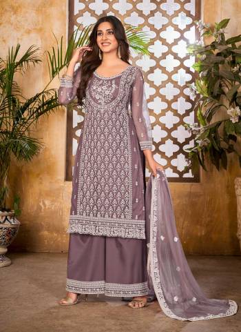 Grab These Plazzo Suit in Fine Dusty Colored Pair With Bottom And Dupatta.These Top And Dupatta Are Fabricated On Net Pair With Santoon Bottom.Its Beautified With Santoon Inner.Its Beautified With Heavy Designer Thread Embroidery Work.