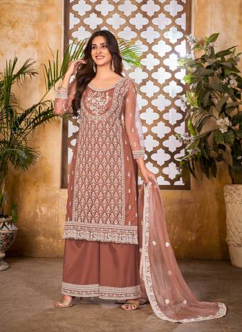 Grab These Plazzo Suit in Fine Dusty Colored Pair With Bottom And Dupatta.These Top And Dupatta Are Fabricated On Net Pair With Santoon Bottom.Its Beautified With Santoon Inner.Its Beautified With Heavy Designer Thread Embroidery Work.