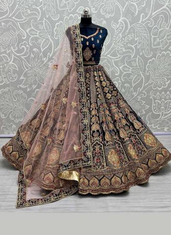 For A Designer Look,Grab These Lehenga Choli in Fine Colored.These Lehenga Choli Are Velvet And Dupatta Are Fabricated On Soft Net Pair.Its Beautified With Fancy Designer Multy Thread,Dori Embroidery Work.