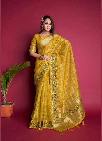 Looking These Festive Wear Saree in Fine Colored.These Saree And Blouse is Fabricated On Organza Silk.Its Beautified With Weavon Jari Checks Designer With Embroidery Work.