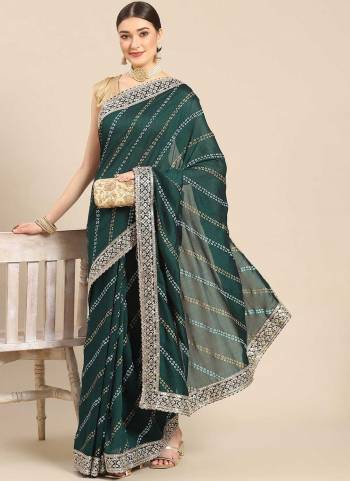 Looking These Festive Wear Saree in Fine Colored.These Saree Are Poly Silk And Blouse is Fabricated On Art Silk.Its Beautified With Bandhani Printed,Sequance Embroidery Work Border.