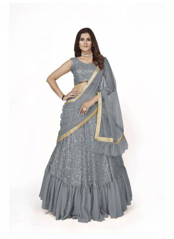 For A Designer Look,Grab These Lehenga Choli in Fine Colored.These Lehenga And Blouse Are Fabricated On Georgette Pair With Soft Net Dupatta.Its Beautified With Heavy Multy Sequance Embroidery Work.