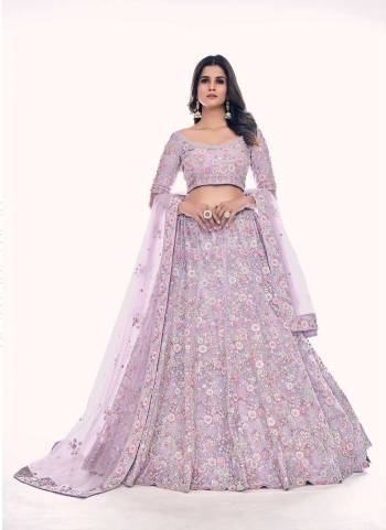 For A Designer Look,Grab These Lehenga Choli in Fine Colored.These Lehenga And Blouse Are Fabricated On Soft Net Pair With Soft Net Dupatta.Its Beautified With Designer Dori,Thread,Sequance Embroidery,Zarkan Work.