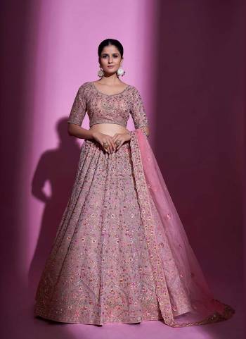 For A Designer Look,Grab These Lehenga Choli in Fine Colored.These Lehenga And Blouse Are Fabricated On Georgette Pair With Soft Net Dupatta.Its Beautified With Designer Heavy Embroidery Work.