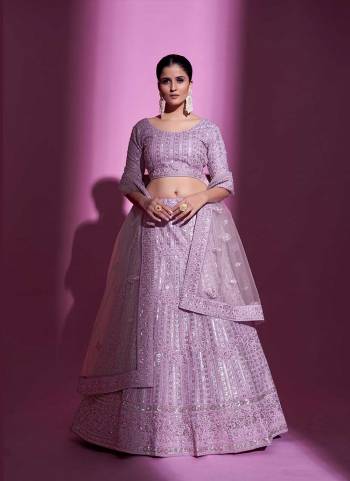 For A Designer Look,Grab These Lehenga Choli in Fine Colored.These Lehenga And Blouse Are Fabricated On Soft Net Pair With Soft Net Dupatta.Its Beautified With Designer Heavy Embroidery Work.