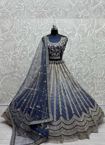 For A Designer Look,Grab These Lehenga Choli in Fine Colored.These Lehenga Are Silk Choli Are Silk And Dupatta Are Fabricated On Soft Net Pair.Its Beautified With Fancy Designer Thread,Jari Embroidery,Zarkan Diamond Work.