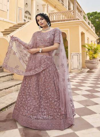 Attrective Looking These Partywear Lehenga Choli in Fine Colored Pair With Dupatta.These Blouse And Dupatta Net Are Fabricated On Net Pair Lehenga.Its Beautified With Heavy Designer Embroidery With Zarkan Diamond Work.