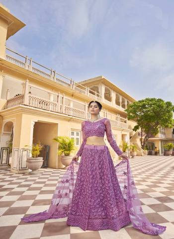 Attrective Looking These Partywear Lehenga Choli in Fine Colored Pair With Dupatta.These Blouse And Dupatta Net Are Fabricated On Net Pair Lehenga.Its Beautified With Heavy Designer Embroidery With Zarkan Diamond Work.