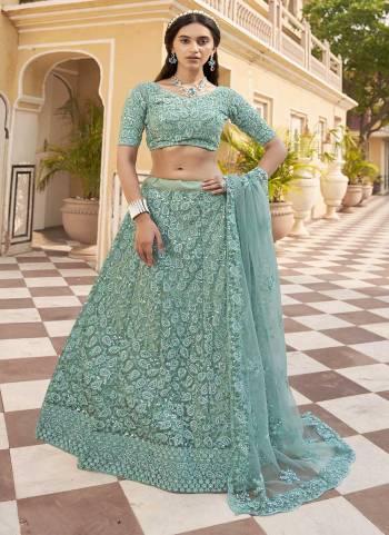 Attrective Looking These Partywear Lehenga Choli in Fine Colored Pair With Dupatta.These Blouse And Dupatta Net Are Fabricated On Net Pair Lehenga.Its Beautified With Heavy Designer Embroidery With Zarkan Diamond Work.