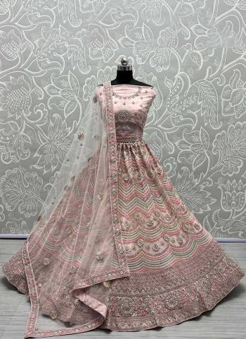 For A Designer Look,Grab These Lehenga Choli in Fine Colored.These Lehenga Choli Are Bridal Net And Dupatta Are Fabricated On Soft Net Pair.Its Beautified With Fancy Designer Multy Thread,Jari Embroidery Work.