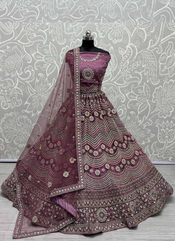 For A Designer Look,Grab These Lehenga Choli in Fine Colored.These Lehenga Choli Are Bridal Net And Dupatta Are Fabricated On Soft Net Pair.Its Beautified With Fancy Designer Multy Thread,Jari Embroidery Work.