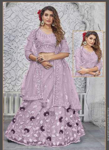 For A Designer Look,Grab These Semi Stitched Lehenga Choli in Fine Colored.These Lehenga And Blouse Are Fabricated On Net Pair With Net Dupatta.Its Beautified With Designer Heavy Embroidery Work.