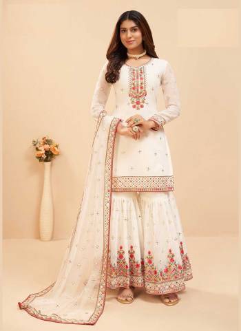 Attrective These Sharara Suit in Fine Colored Pair With Bottom And Dupatta.These Top And Dupatta Are Fabricated On Faux Georgette Pair With Faux Georgette Bottom.Its Beautified With Santoon Inner.Its Beautified With Heavy Designer Mirror,Multy Embroidery Work.