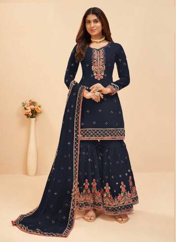 Attrective These Sharara Suit in Fine Colored Pair With Bottom And Dupatta.These Top And Dupatta Are Fabricated On Faux Georgette Pair With Faux Georgette Bottom.Its Beautified With Santoon Inner.Its Beautified With Heavy Designer Mirror,Multy Embroidery Work.