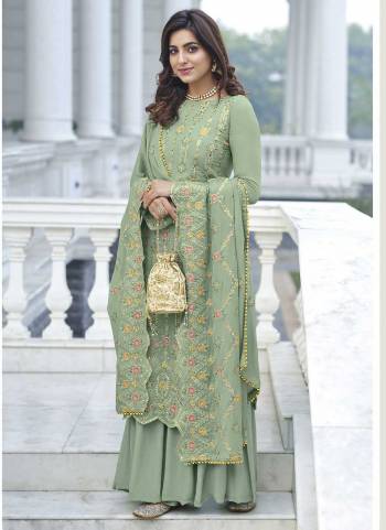 Attrective These Sharara Suit in Fine Colored Pair With Bottom And Dupatta.These Top And Dupatta Are Fabricated On Faux Georgette Pair With Santoon Bottom.Its Beautified With Santoon Inner.Its Beautified With Heavy Designer Multy Thread Embroidery Work.