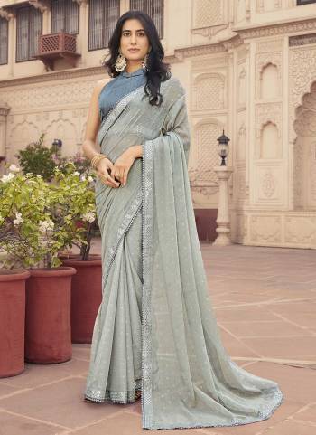 Grab These Party Wear Saree in Fine Light Colored.These Saree Are Samundri Chiffon And Blouse is Fabricated On Banglori.Its Beautified With Designer Foil Printed With Embroidery Work Lace Border.