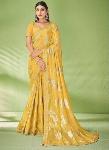 Look Attrective These Party Wear Saree in Fine Colored.These Saree Are Georgette And Blouse  is Fabricated On Raw Silk.Its Beautified With Wevon Designer With Embroidery Work.