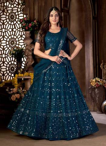 For A Designer Look,Grab These Lehenga Choli in Fine Colored.These Lehenga And Blouse Are Fabricated On Net Pair With Net Dupatta.Its Beautified With Foil Mirror,Multy Embroidery Work.