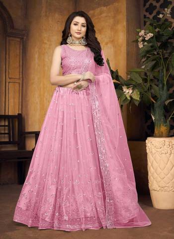 For A Designer Look,Grab These Lehenga Choli in Fine Colored.These Lehenga And Blouse Are Fabricated On Butterfly Net Pair With Butterfly Net Dupatta.Its Beautified With Mirror,Thread Embroidery Work.