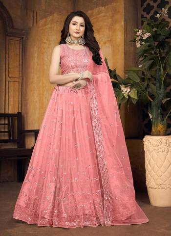 For A Designer Look,Grab These Lehenga Choli in Fine Colored.These Lehenga And Blouse Are Fabricated On Butterfly Net Pair With Butterfly Net Dupatta.Its Beautified With Mirror,Thread Embroidery Work.