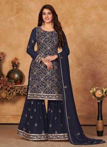 Grab These Designer Sharara Suit in Fine Colored Pair With Bottom And Dupatta.These Top And Dupatta Are Fabricated On Faux Georgette Pair With Santoon Bottom.Its Beautified With Santoon Inner.Its Beautified With Heavy Designer Jari,Sequance Embroidery Work.