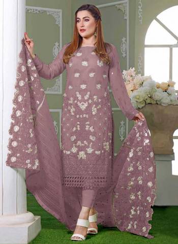 Garb These Designer Suit in Fine Colored Pair With Bottom And Dupatta.These Top Are Faux Georgette And Dupatta Are Fabricated On Nazmeen Pair With Santoon Bottom.Its Beautified With Santoon Inner.Its Beautified With Designer Embroidery Work.