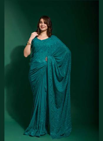 Grab These Party Wear Saree in Fine Colored.These Saree Are Georgette And Blouse is Georgette Fabricated.Its Beautified With Blooming Color,Designer Tone To Tone Thread Embroidery,Diamond Work.