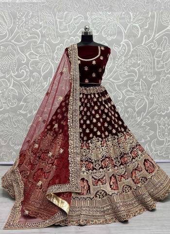 For A Designer Look,Grab These Lehenga Choli With Dupatta in Fine Colored.These Lehenga And Choli Are Velvet And Dupatta Are Fabricated On Soft Net Pair.Its Beautified With Designer Fancy Multy Thread Embroidery,Zarkan Diamond Work.