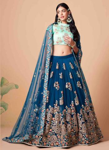 For A Designer Look,Grab These Lehenga Choli in Fine Colored.These Lehenga And Dupatta Are Fabricated On Soft Net Pair With Art Silk Blouse.Its Beautified With Designer Thread,Mirror,Dori,Sequance Embroidery Work.