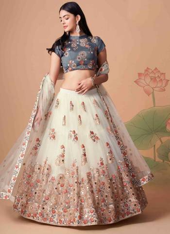 For A Designer Look,Grab These Lehenga Choli in Fine Colored.These Lehenga And Dupatta Are Fabricated On Soft Net Pair With Art Silk Blouse.Its Beautified With Designer Thread,Mirror,Dori,Sequance Embroidery Work.