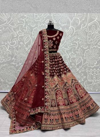 For A Designer Look,Grab These Lehenga Choli With Dupatta in Fine Colored.These Lehenga And Choli Are Velvet And Dupatta Are Fabricated On Soft Net Pair.Its Beautified With Designer Fancy Multy Thread Embroidery,Zarkan Diamond Work.